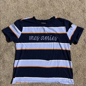 blue, orange, light blue striped shirt “mes amies”